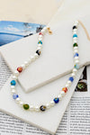Collar de Perlas con Cuentas de Vidrio Glaseado Estacionadas: Elegancia y Color