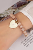 Pulsera Elástica de Cuentas con Dije de Corazón - Elegancia y Estilo