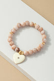Pulsera Elástica de Cuentas con Dije de Corazón - Elegancia y Estilo