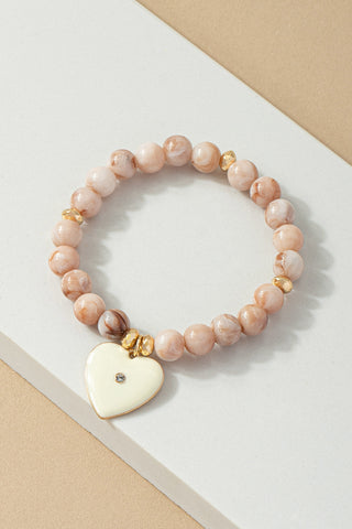 Pulsera Elástica de Cuentas con Dije de Corazón - Elegancia y Estilo