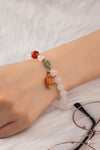Pulsera elástica de cuentas de ágata transparente con dije de ágata marrón