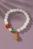 Pulsera elástica de cuentas de ágata transparente con dije de ágata marrón