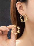 aretes de aro con varias flores