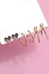 Pendientes de aro con forma de corazón y lazo de trío
