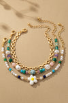 Elegante set de 3 pulseras con cuentas, flores y cadena - Realza tu estilo