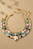 Elegante set de 3 pulseras con cuentas, flores y cadena - Realza tu estilo