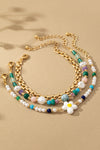 Elegante set de 3 pulseras con cuentas, flores y cadena - Realza tu estilo
