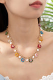 Collar de flor de vidrio esmaltado y perla de agua dulce