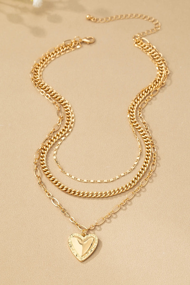 Collar de 3 Capas con Cadena Mixta y Colgante de Corazón: Elegancia en Cada Detalle by Yanet Collective