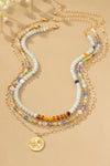 Collar Tricolor con Cuentas y Colgante de Trébol - Elegancia Artesanal