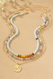 Collar Tricolor con Cuentas y Colgante de Trébol - Elegancia Artesanal