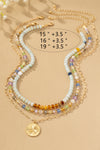 Collar Tricolor con Cuentas y Colgante de Trébol - Elegancia Artesanal