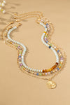 Collar Tricolor con Cuentas y Colgante de Trébol - Elegancia Artesanal
