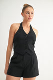 Top de chaleco con botones y cuello halter negro