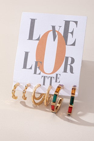 Conjunto de tres pendientes de aro con textura mixta y piedras preciosas