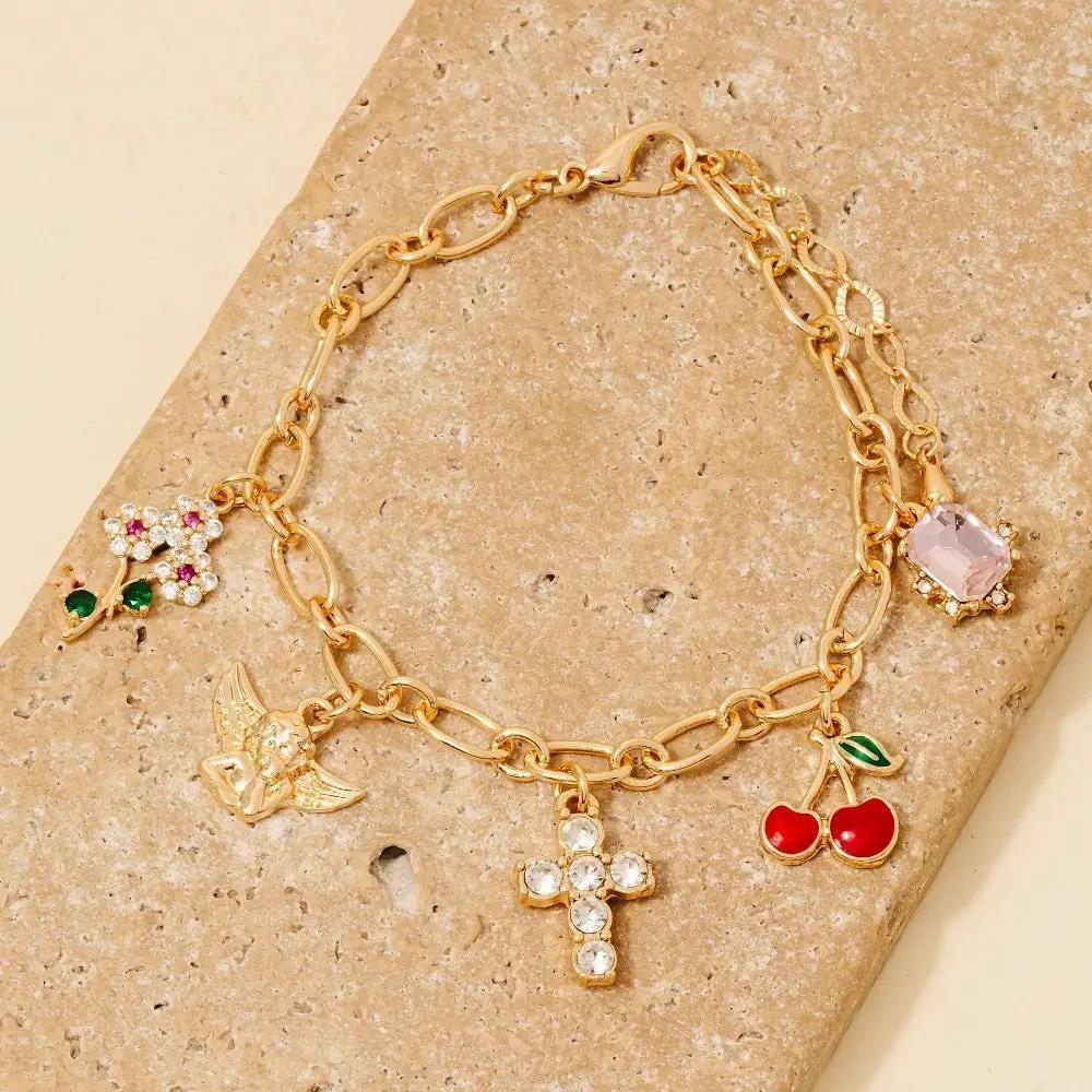 Pulsera de Cadena con Cruz de Querubín y Abalorios de Cereza by Yanet Collective