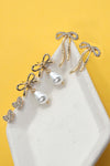 Pendientes con lazo de perla y corazón de diamantes de imitación