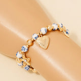 Brazalete Floral de Cerámica con Dijes de Corazón y Flores