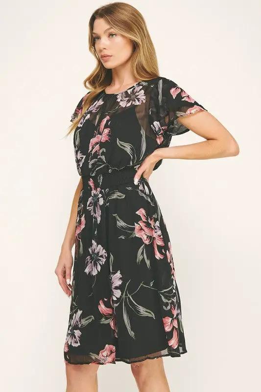 Vestido Negro de Gasa con Estampado Floral y Cintura Fruncida con Volantes by Yanet Collective