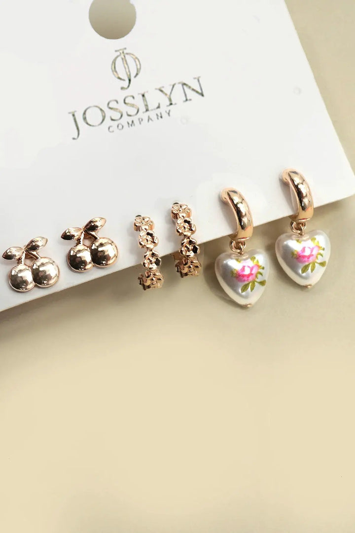 Trío de aros Huggie con forma de corazón y diseño floral de cereza by Yanet Collective