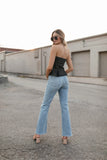 Top mezclilla abotonado strapless