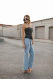 Top mezclilla abotonado strapless