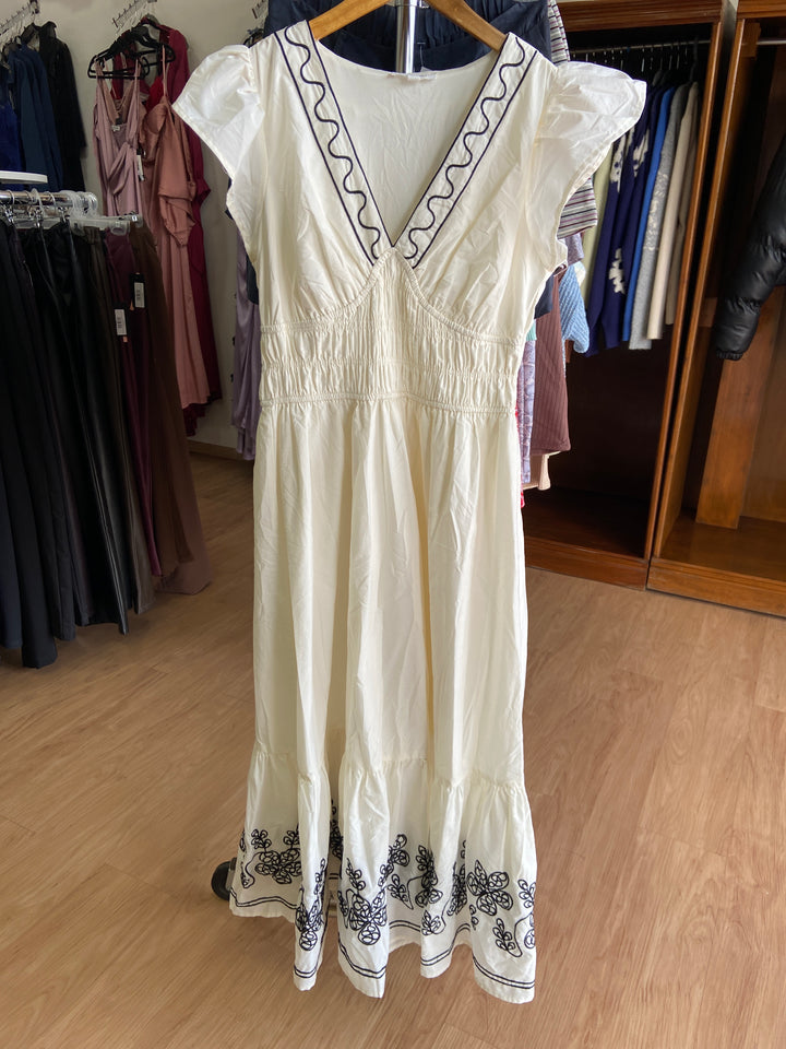Vestid beige con costuras negras