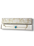 Pulsera banada en oro con dije azul