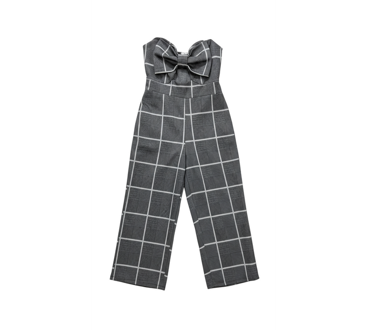 Yanet Collective strapless jumpsuit in black and white plaid with a bow detail on the bodice and wide-leg fit.