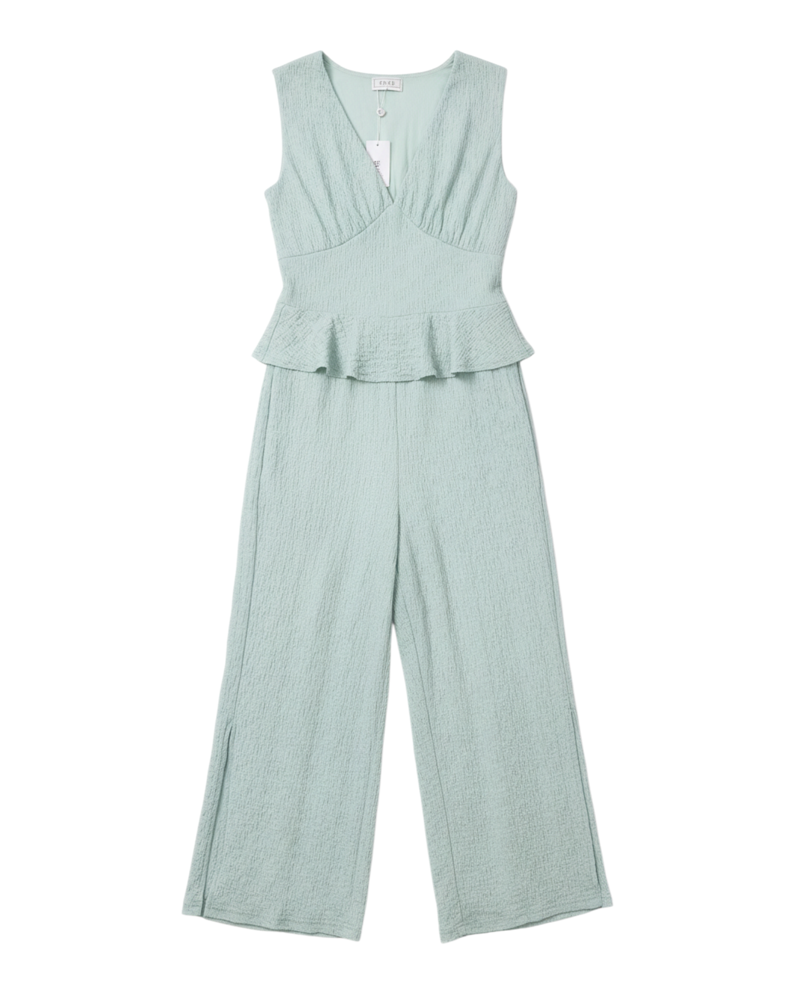 Jumpsuit Yanet Collective color menta con escote en V, diseño sin mangas y detalle peplum en tejido texturizado.