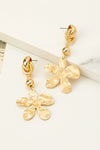 Pendientes colgantes de flores de metal coronados por un nudo , aretes