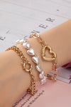 3 pulseras con palanca de corazón y perlas de corazón