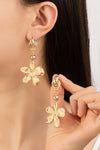 Pendientes colgantes de flores de metal coronados por un nudo , aretes