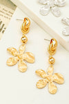 Pendientes colgantes de flores de metal coronados por un nudo , aretes
