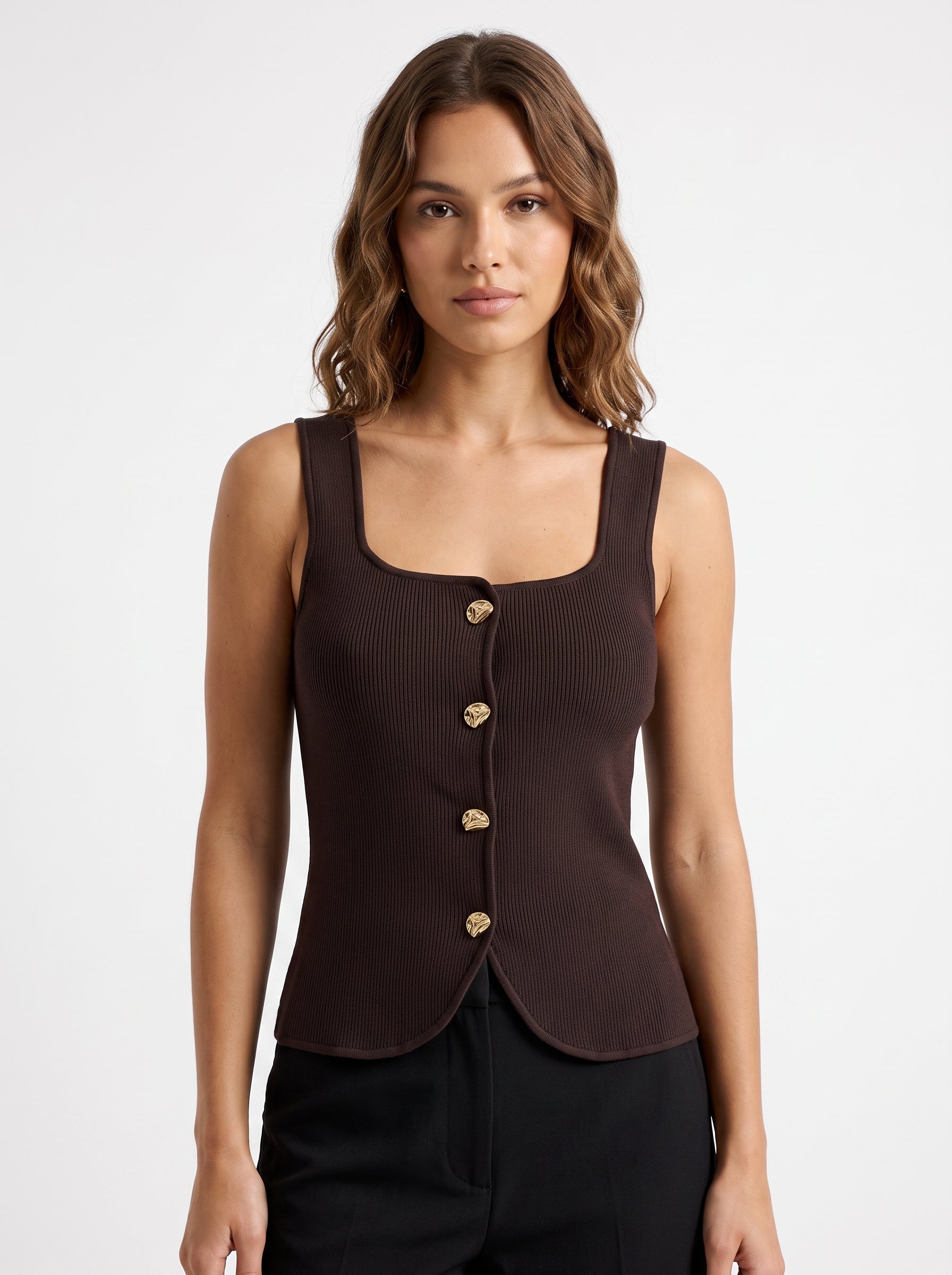 Studio photo of Blusa de Punto Café Lujo para Estilo Distinguido Standing facing the camera, natural confident posture, arms relaxed at sides, front view, full body visible. CAMERA SHOT: A FULL BODY shot capturing the person from head to toe. [Upper body focus]