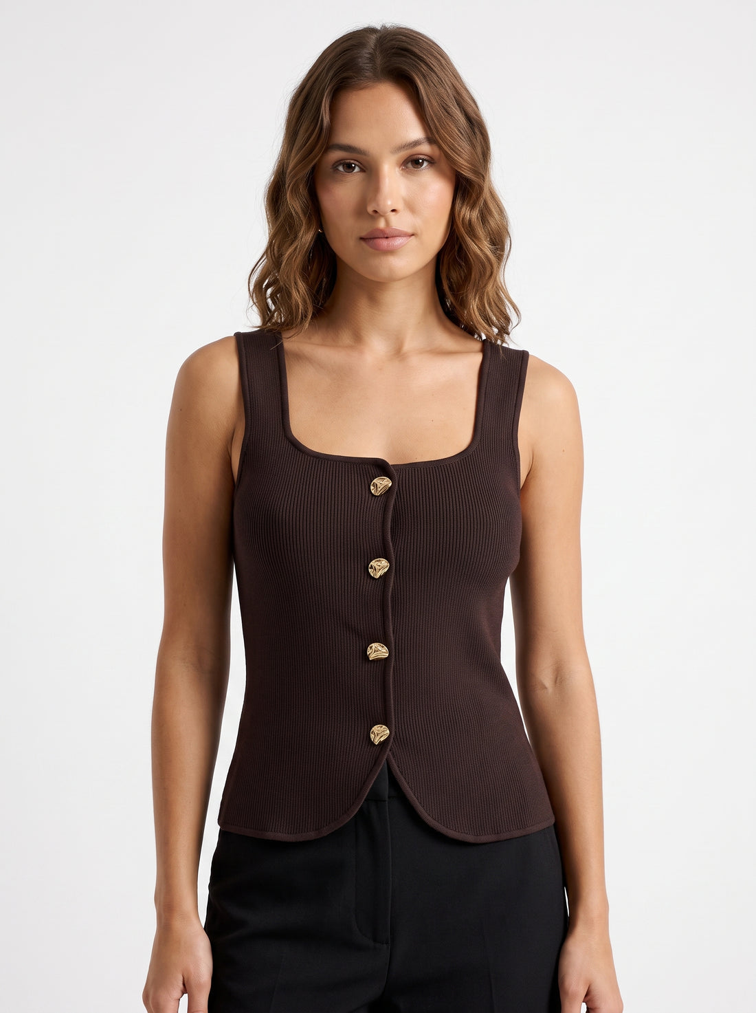 Studio photo of Blusa de Punto Café Lujo para Estilo Distinguido Standing facing the camera, natural confident posture, arms relaxed at sides, front view, full body visible. CAMERA SHOT: A FULL BODY shot capturing the person from head to toe. [Upper body focus]
