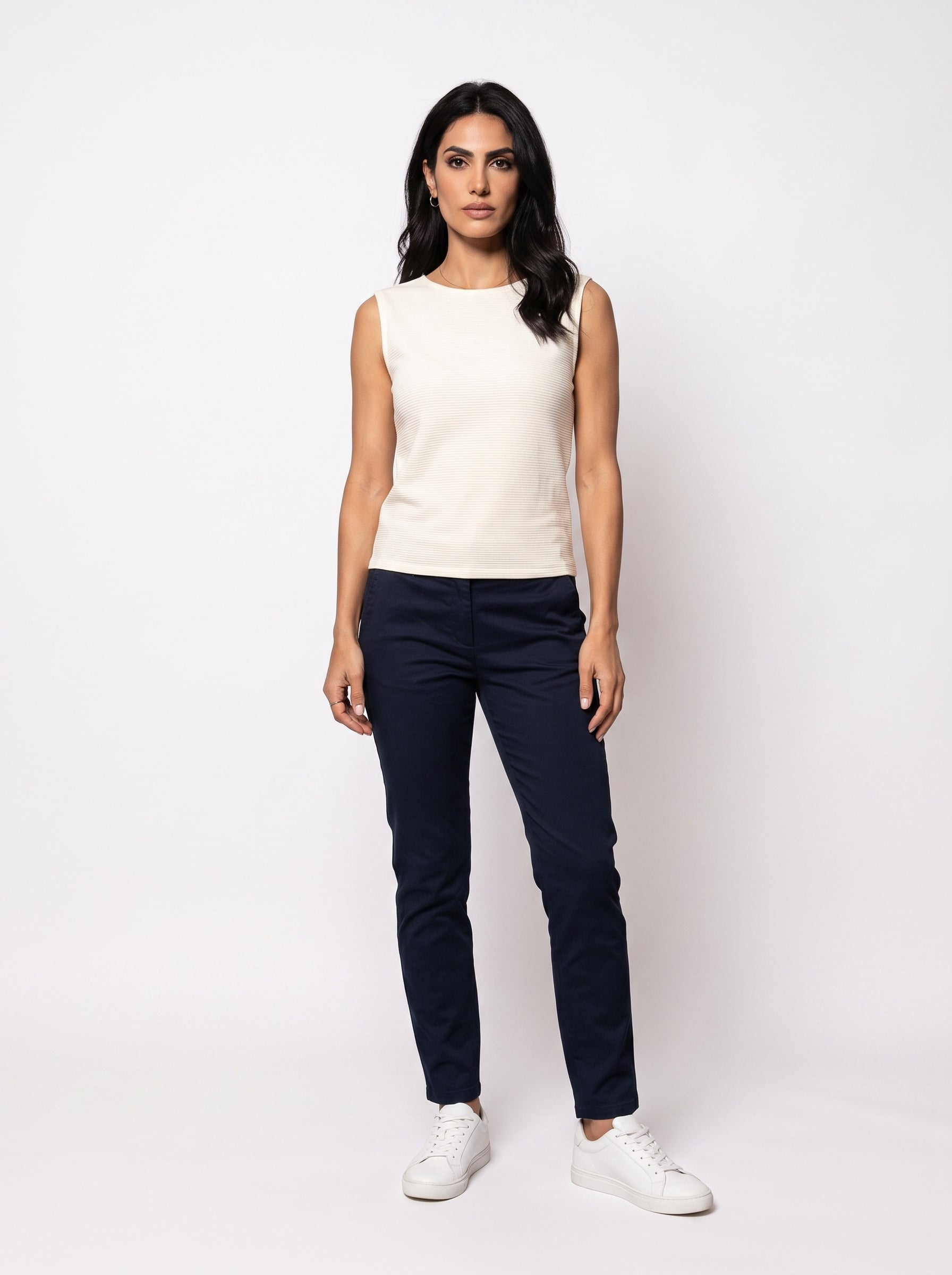 Studio photo of Blusa Standing facing the camera, natural confident posture, arms relaxed at sides, front view, full body visible. CAMERA SHOT: A FULL BODY shot capturing the person from head to toe. [Full body]