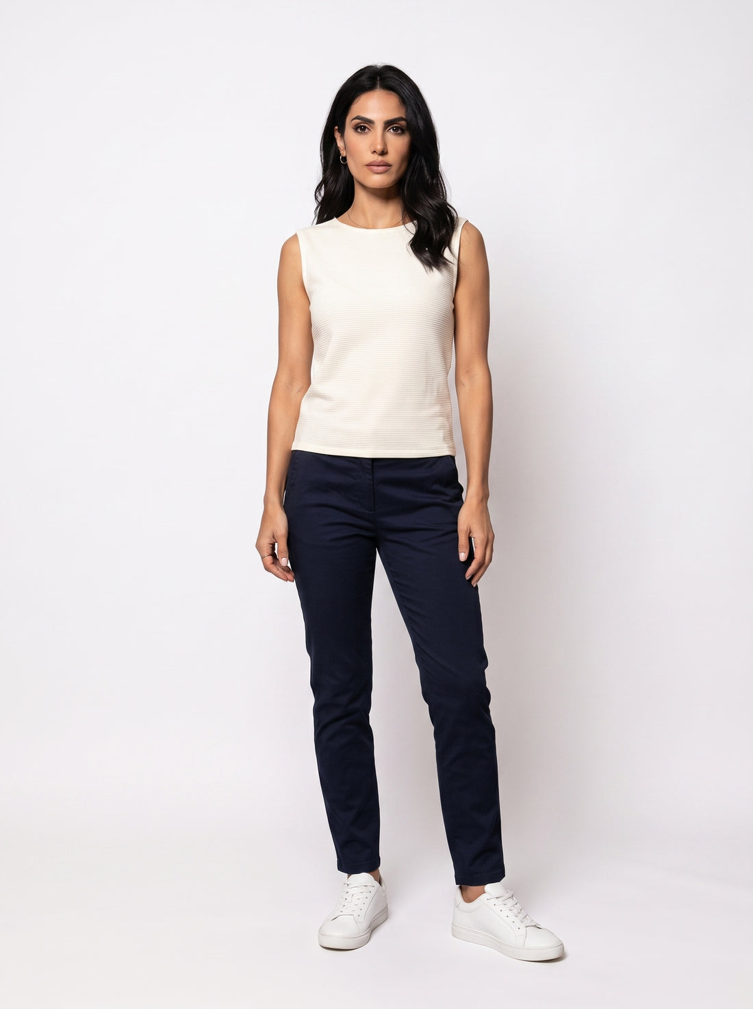 Studio photo of Blusa Standing facing the camera, natural confident posture, arms relaxed at sides, front view, full body visible. CAMERA SHOT: A FULL BODY shot capturing the person from head to toe. [Full body]