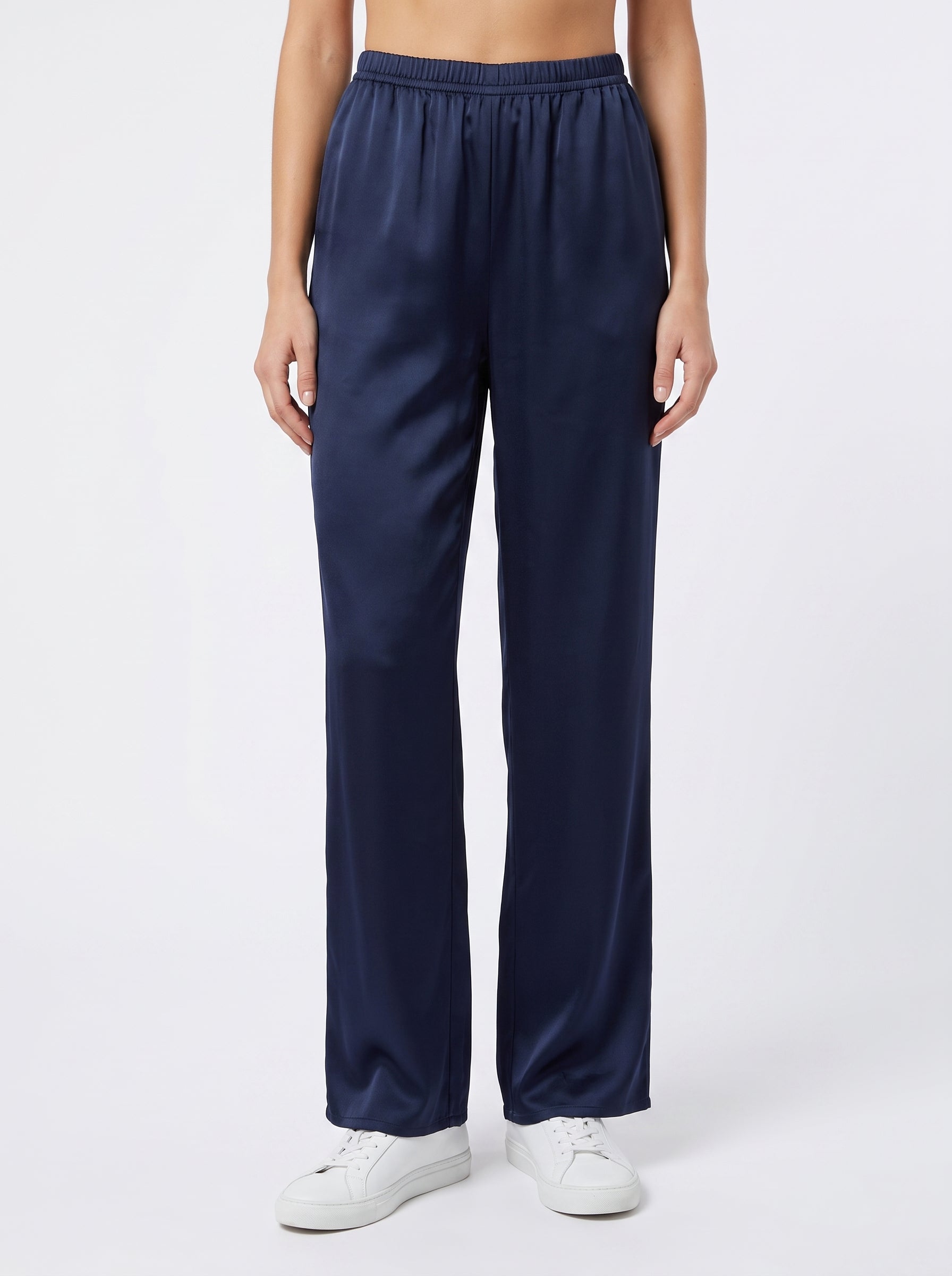 Studio photo of Pantalón azul marino satin Lower body shot from waist down, facing camera, showing pants/skirt front, legs straight. CAMERA SHOT: A FULL BODY shot capturing the person from head to toe. [Full body]