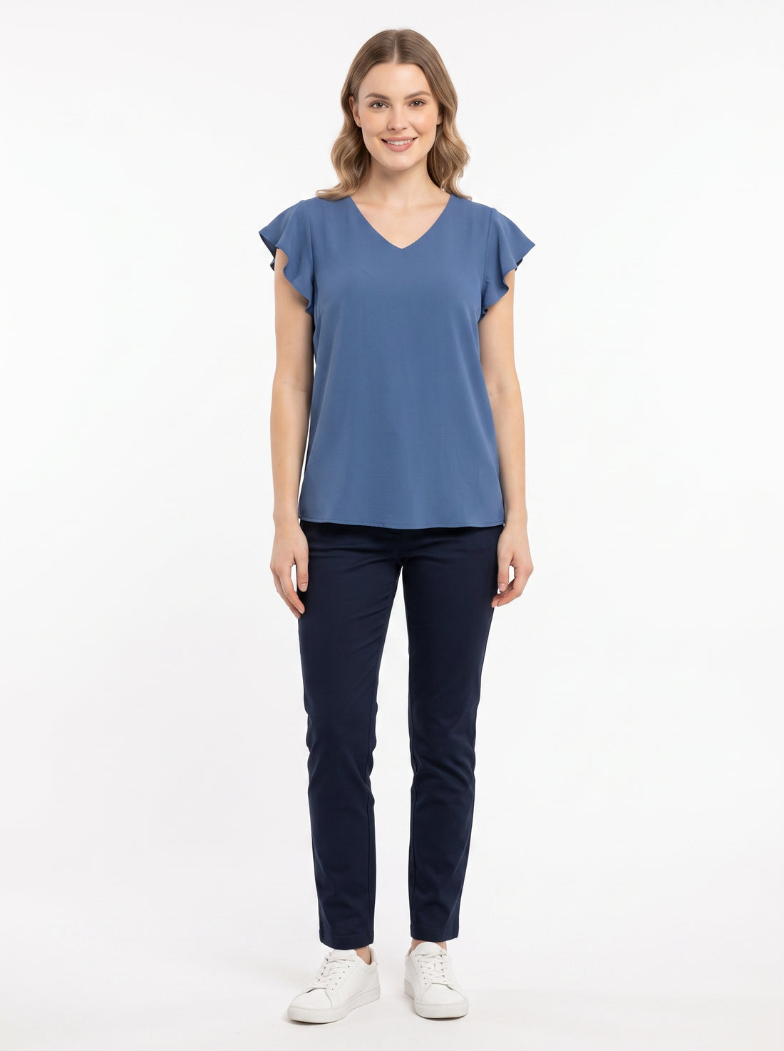 Studio photo of Blusa De Crepé Para Mujer Moderna Con Silueta Recta Y Acabados Refinados Standing facing the camera, natural confident posture, arms relaxed at sides, front view, full body visible. CAMERA SHOT: A FULL BODY shot capturing the person from head to toe. [Full body]