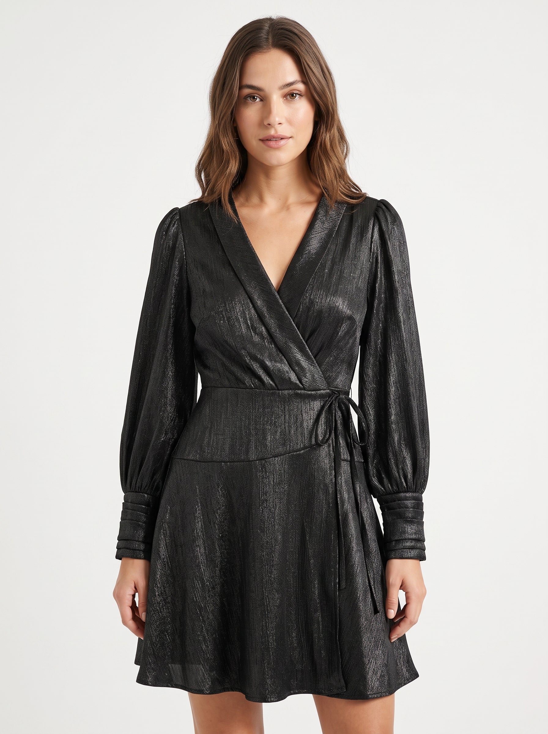 Studio photo of Vestido Corto Negro de Manga Larga para Mujer Elegante y Versátil Ideal para Fiesta y Diario Upper body shot from chest up, facing camera, natural expression, shoulders relaxed. CAMERA SHOT: A FULL BODY shot capturing the person from head to toe. [Upper body focus]