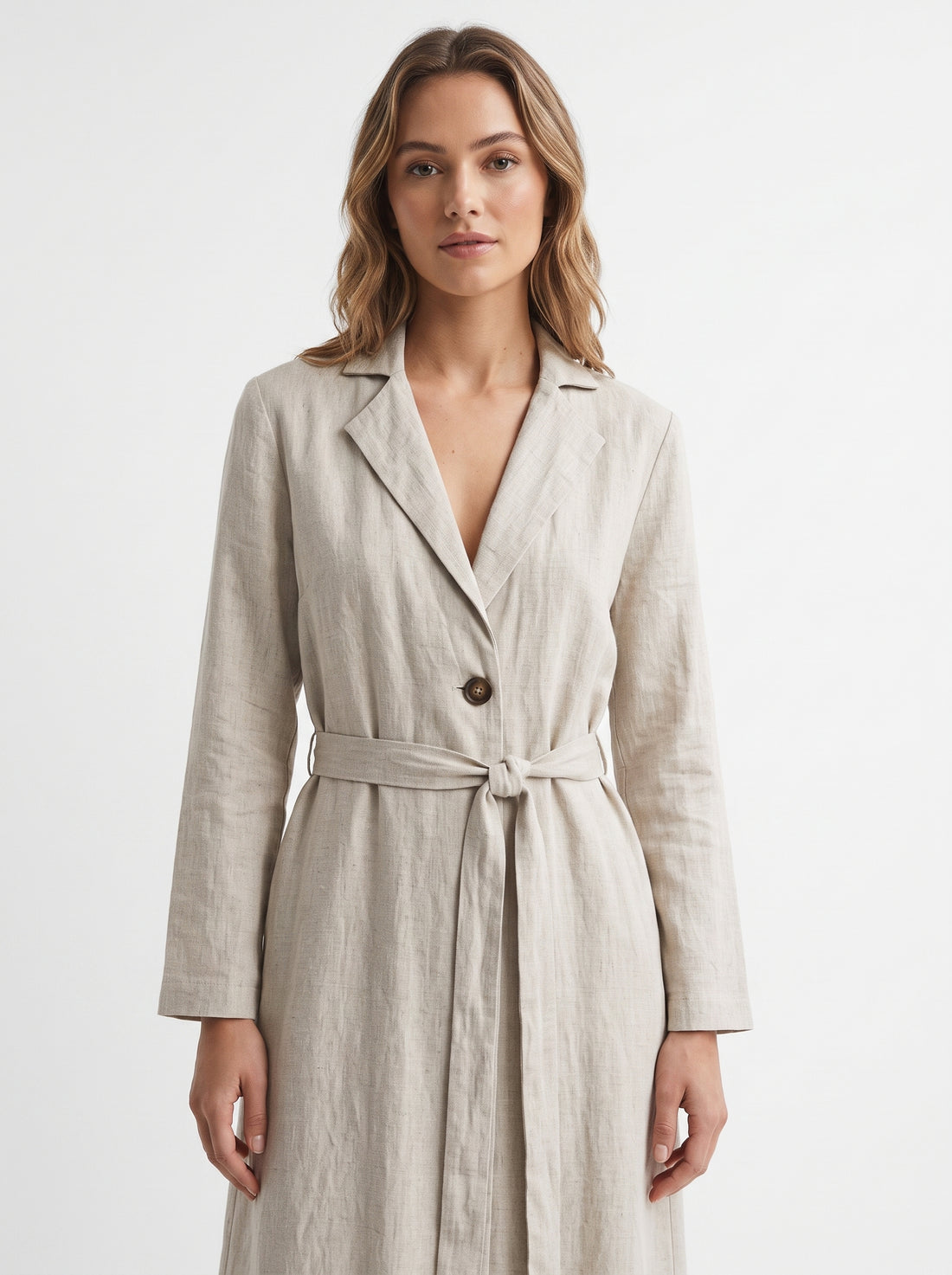 Studio photo of Vestido Beige Manga Larga Para Mujer Elegante Y Versátil Ideal Para Ocasiones Formales Y Casuales Upper body shot from chest up, facing camera, natural expression, shoulders relaxed. CAMERA SHOT: A FULL BODY shot capturing the person from head to toe. [Upper body focus]