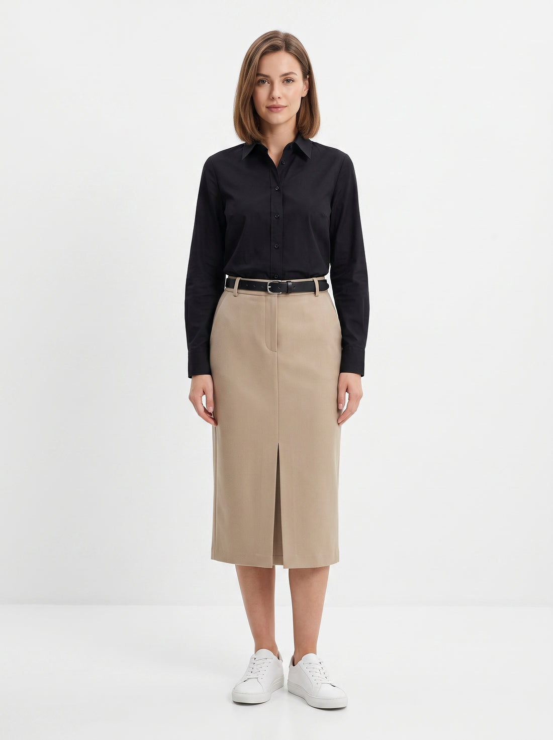 Studio photo of Falda beige Standing facing the camera, natural confident posture, arms relaxed at sides, front view, full body visible. CAMERA SHOT: A FULL BODY shot capturing the person from head to toe. [Full body]