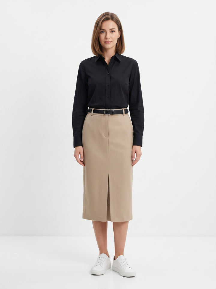 Studio photo of Falda beige Standing facing the camera, natural confident posture, arms relaxed at sides, front view, full body visible. CAMERA SHOT: A FULL BODY shot capturing the person from head to toe. [Full body]