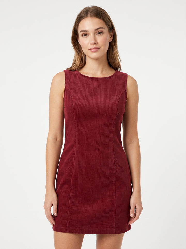 Studio photo of Vestido rojo pana Upper body shot from chest up, facing camera, natural expression, shoulders relaxed. CAMERA SHOT: A FULL BODY shot capturing the person from head to toe. [Upper body focus]