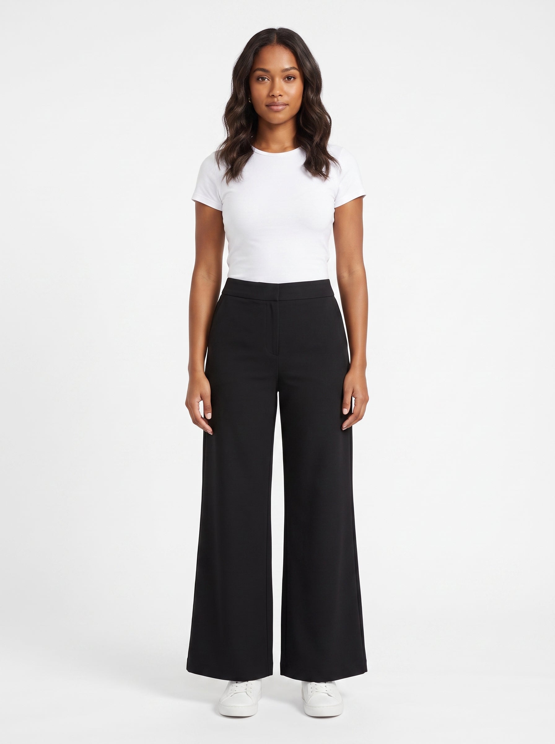 Studio photo of Pantalón Lower body shot from waist down, facing camera, showing pants/skirt front, legs straight. CAMERA SHOT: A FULL BODY shot capturing the person from head to toe. [Upper body focus]