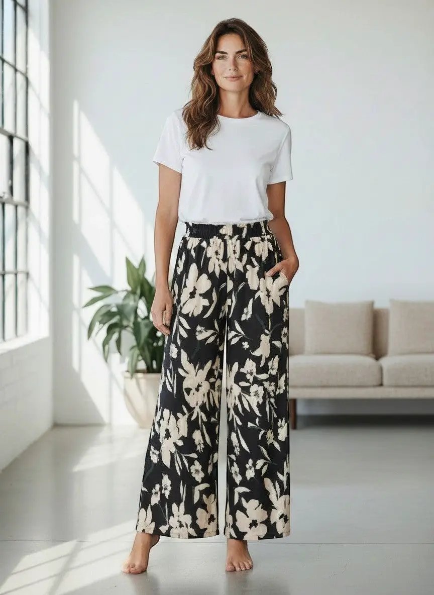 Pantalón Negro Floral Seda De La Colección Luxe Atelier Edición Limitada Con Detalles En Bordado Sutil by Yanet Collective
