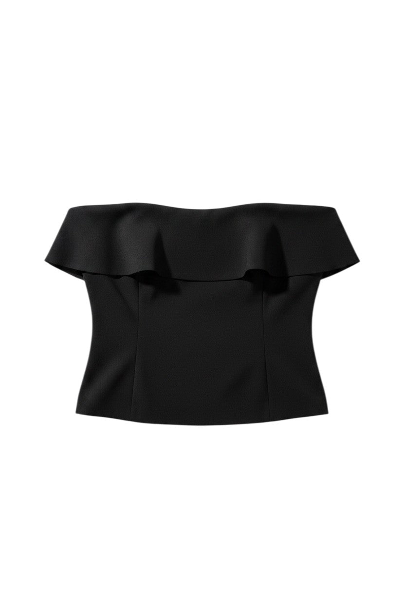 Yanet Collective black strapless top featuring a ruffled neckline and fitted bodice design.