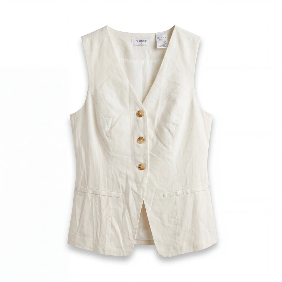 Blusa peplum Yanet Collective sin mangas en color crema con botones frontales y diseño elegante de estilo boutique