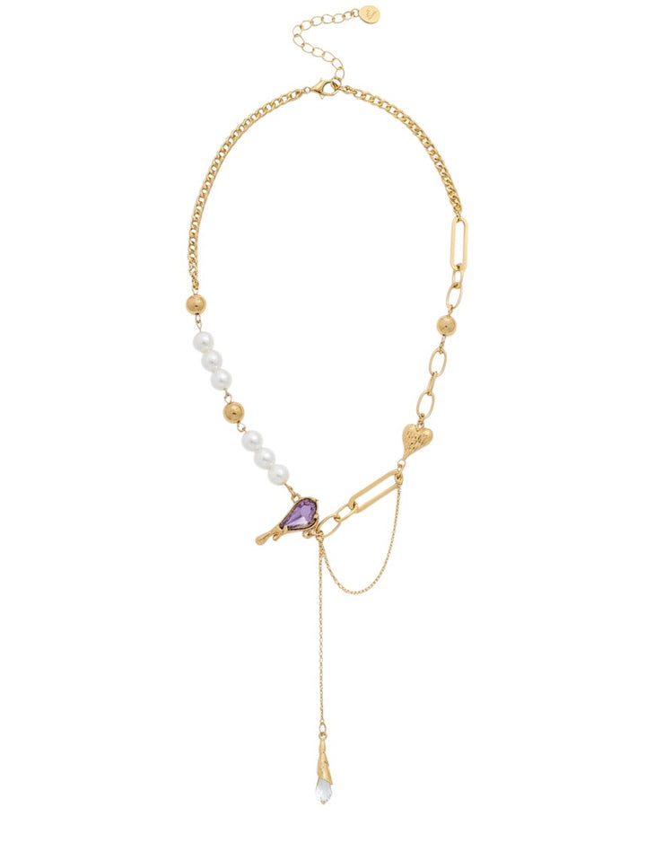 Yanet Collective gold chain necklace with white pearls, a purple heart-shaped pendant, and a delicate drop charm.